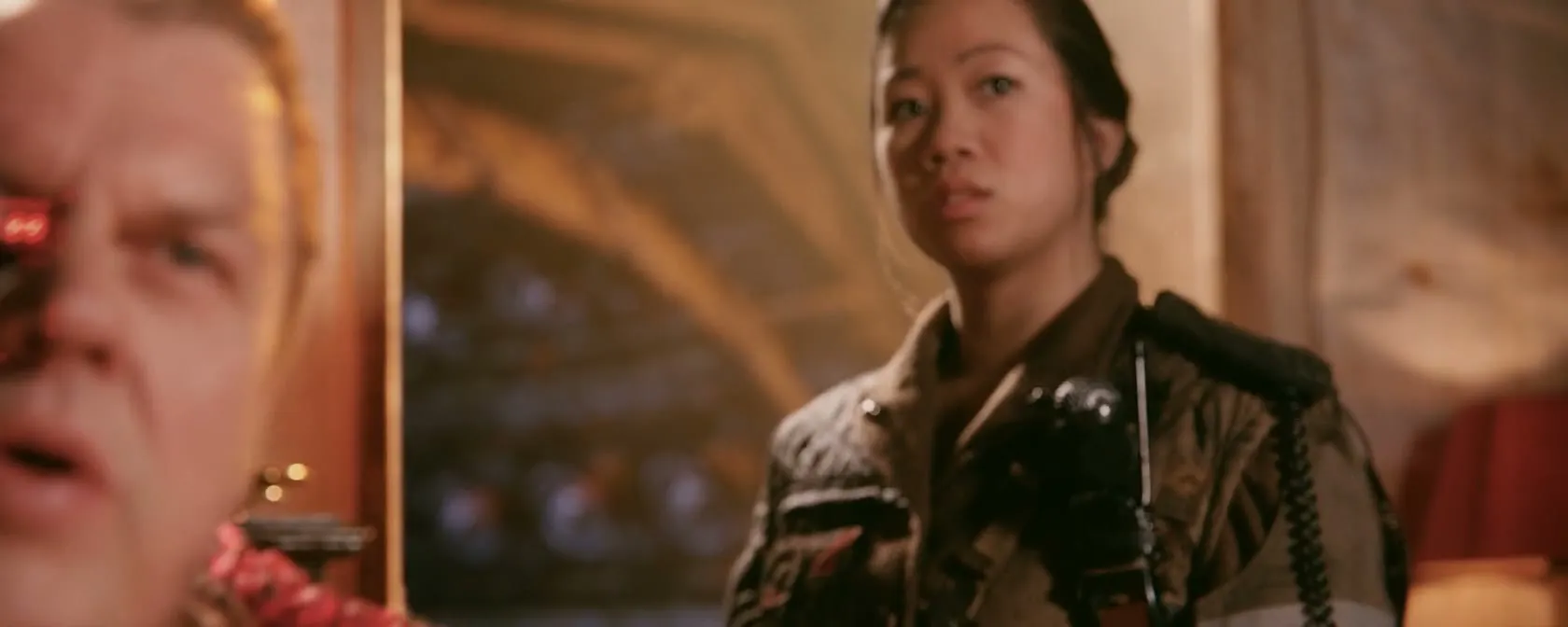 Tears of Steel: a man with a glowing eye implant beside a woman holding a camera rig